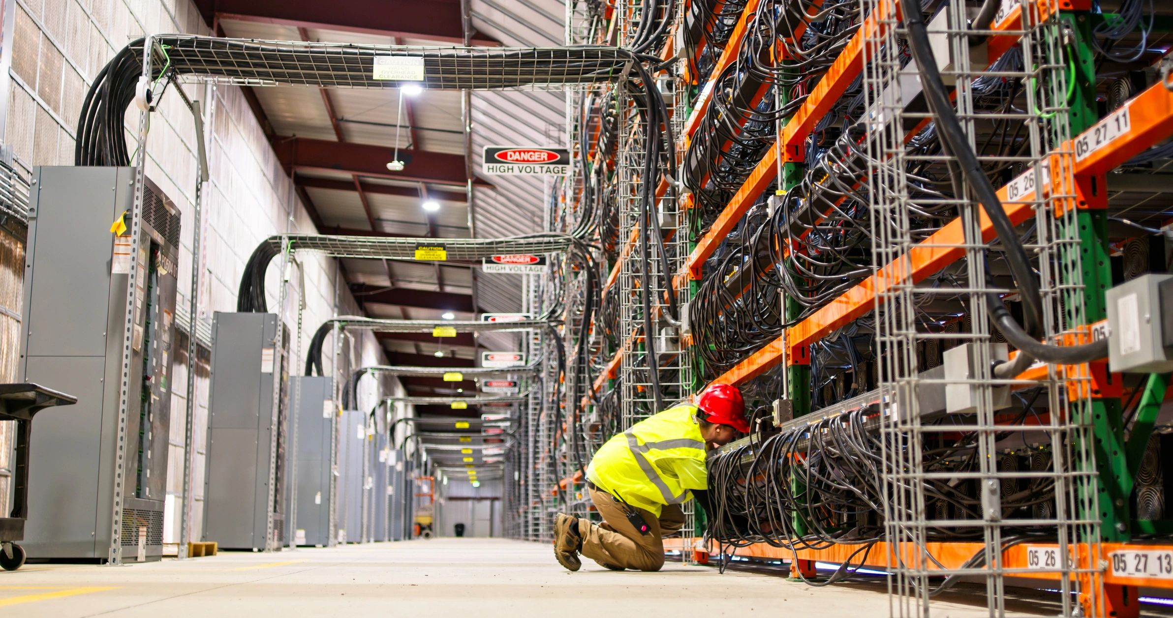 Technician working in a server room for network maintenance