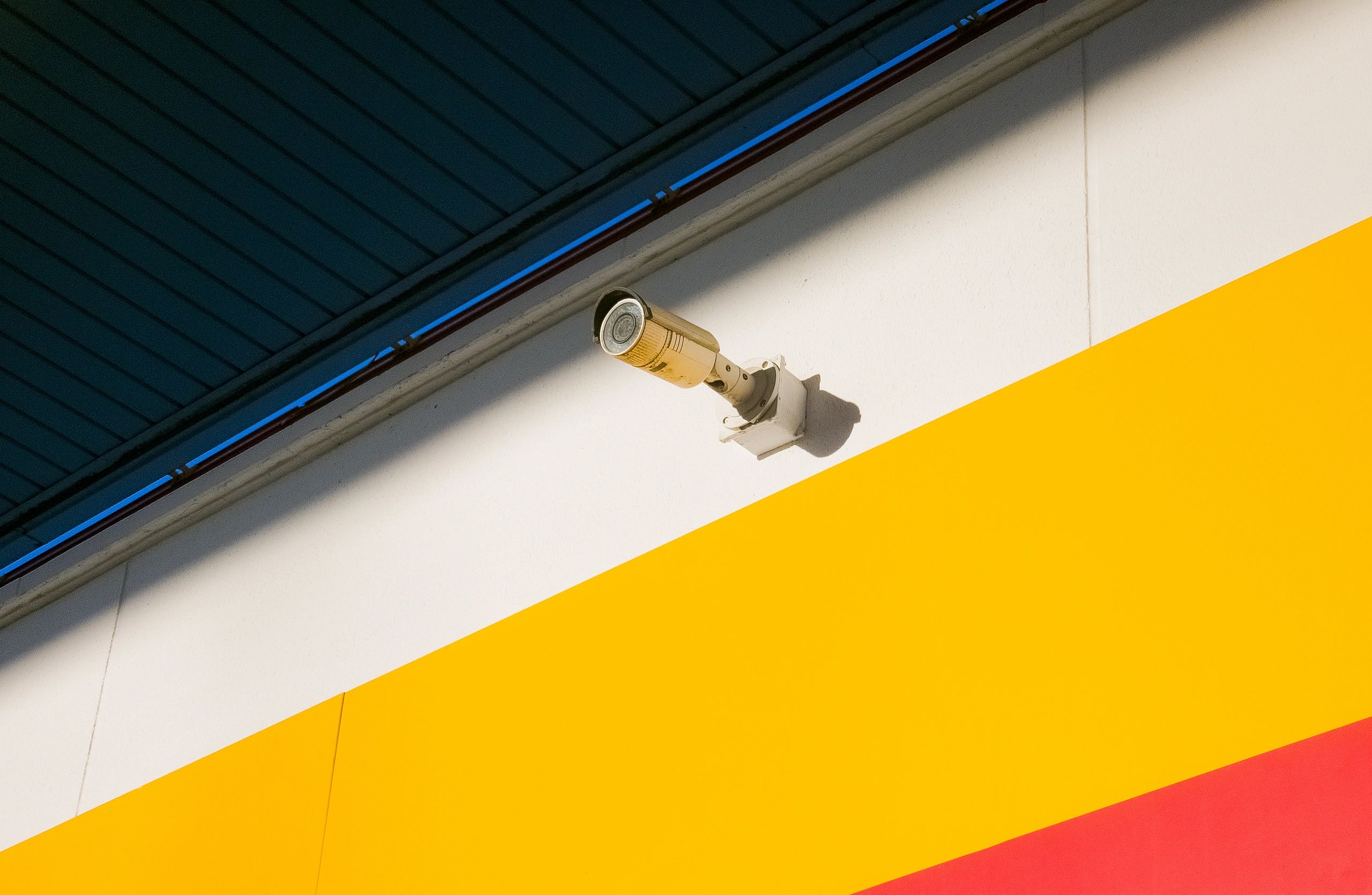 Security camera mounted on a building wall